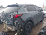 ✅ 2023 Mazda CX-5 S Carbon Edition • VIN: JM3KFBCM7P0104374 • Лот: 42329421. Опубликован ранее на IAAI с пробегом 27 575 миль. Бесплатный доступ к архиву аукционных продаж из США и подробный отчёт об истории автомобиля на DreamBid. Изображение 4.