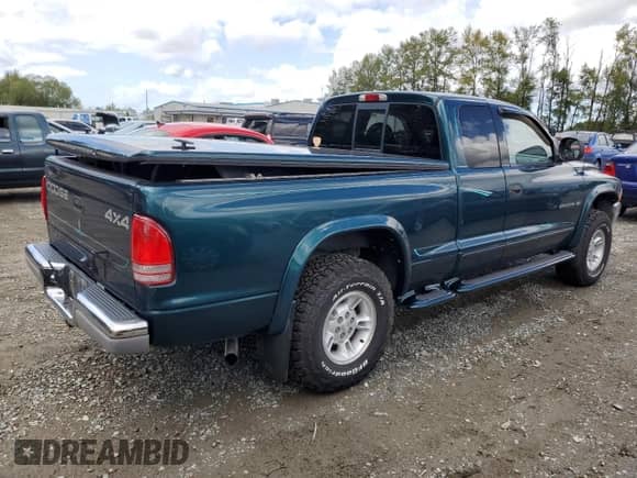 1998 Dodge Dakota SLT z VIN 1B7GG22YXWS639234, wystawiony jako Copart lot #68892734 z przebiegiem 123 588 mil mil oraz Szkoda całkowita • Salvage title. Historia ofert i sprzedaży dostępna na DreamBid. Obrazek 3.