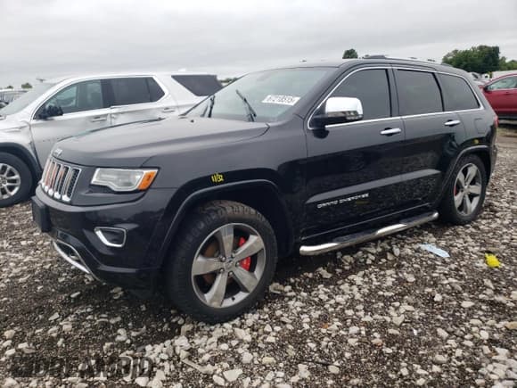 ✅ 2014 Jeep Grand Cherokee Overland • VIN: 1C4RJFCGXEC417387 • Lot: 67218515. Listed on Copart with 183,674 mi. Free auction sales archive from the USA and detailed vehicle history report at DreamBid. Image 1.