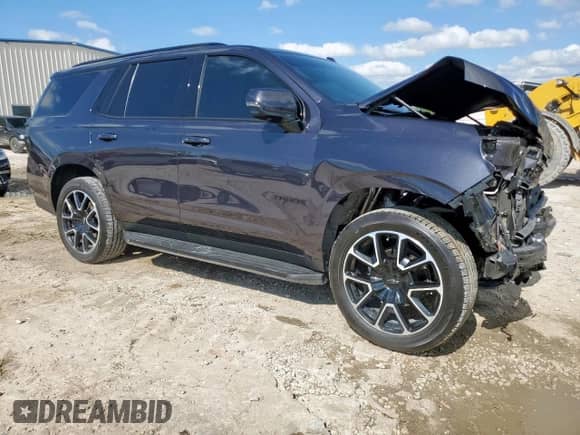 2022 Chevrolet Tahoe RST with VIN 1GNSKRKD6NR213195, listed as a Copart auction lot 56063615 with 54,928 mi miles and Salvage title. Bid and sale history available at DreamBid. Image 4.