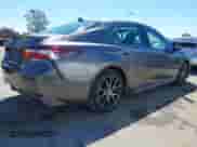 2021 Toyota Camry Hybrid SE z VIN 4T1G31AK6MU551359, wystawiony jako IAAI lot #42995923 z przebiegiem 54 373 mil mil oraz . Historia ofert i sprzedaży dostępna na DreamBid. Obrazek 4.