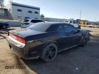 2012 Dodge Challenger SXT z VIN 2C3CDYAG3CH294428, wystawiony jako Copart lot #59977455 z przebiegiem 189 417 mil mil oraz Szkoda całkowita • Salvage title. Historia ofert i sprzedaży dostępna na DreamBid. Obrazek 3.