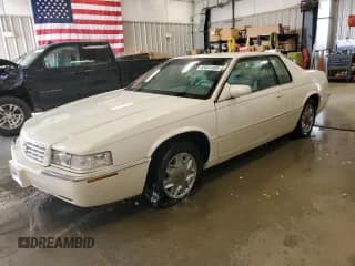 ✅ 1998 Cadillac Eldorado Touring • VIN: 1G6ET1291TU618488 • Lot: 65851485. Listed on Copart with 120,718 mi. Free auction sales archive from the USA and detailed vehicle history report at DreamBid. Image 1.