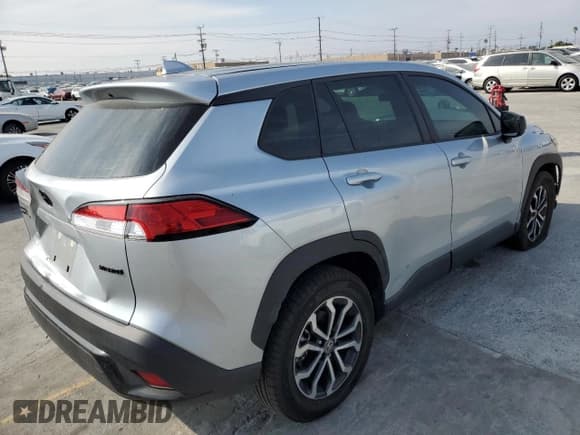 ✅ 2023 Toyota Corolla Cross Hybrid S • VIN: 7MUFBABG5PV017023 • Lot: 90942025. Listed on Copart with 18,740 mi. Free auction sales archive from the USA and detailed vehicle history report at DreamBid. Image 3.