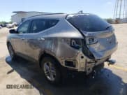 ✅ 2018 Hyundai Santa Fe 2.4L • VIN: 5XYZUDLB3JG568030 • Лот: 57655804. Опубликован ранее на Copart с пробегом 105 599 миль. Бесплатный доступ к архиву аукционных продаж из США и подробный отчёт об истории автомобиля на DreamBid. Изображение 2.