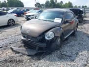 ✅ 2014 Volkswagen Beetle 1.8T • VIN: 3VWJ07AT2EM664064 • Lot: 43036687. Listed on IAAI with 112,000 mi. Free auction sales archive from the USA and detailed vehicle history report at DreamBid. Image 2.