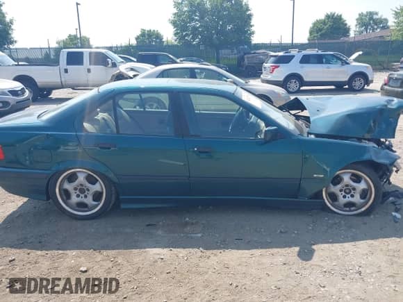 1998 BMW 3 Series 328i with VIN WBACD4321WAV58929, listed as a IAAI auction lot 42423950 with Not provided miles and . Bid and sale history available at DreamBid. Image 13.