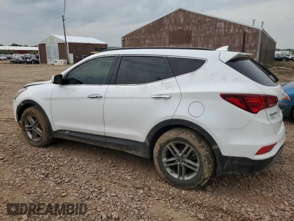 ✅ 2018 Hyundai Santa Fe 2.4L • VIN: 5XYZUDLB5JG554520 • Лот: 60901313. Опубликован ранее на Copart с пробегом 103 306 миль. Бесплатный доступ к архиву аукционных продаж из США и подробный отчёт об истории автомобиля на DreamBid. Изображение 2.