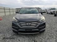 ✅ 2018 Hyundai Santa Fe 2.4L • VIN: 5XYZT3LB2JG511427 • Lot: 91376305. Listed on Copart with 153,523 mi. Free auction sales archive from the USA and detailed vehicle history report at DreamBid. Image 13.