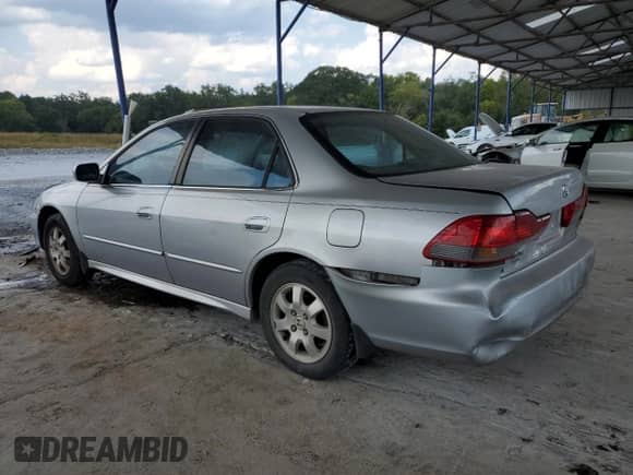 2001 Honda Accord EX с VIN 1HGCG56651A027211, выставлен на аукционе Copart как лот 81212005 с пробегом 328 583 миль миль и Списание • Salvage title. История ставок и продаж доступна на DreamBid. Изображение 2.