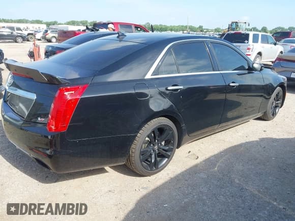 ✅ 2014 Cadillac CTS Vsport RWD • VIN: 1G6AU5S80E0157000 • Lot: 42421328. Listed on IAAI with 130,953 mi. Free auction sales archive from the USA and detailed vehicle history report at DreamBid. Image 4.