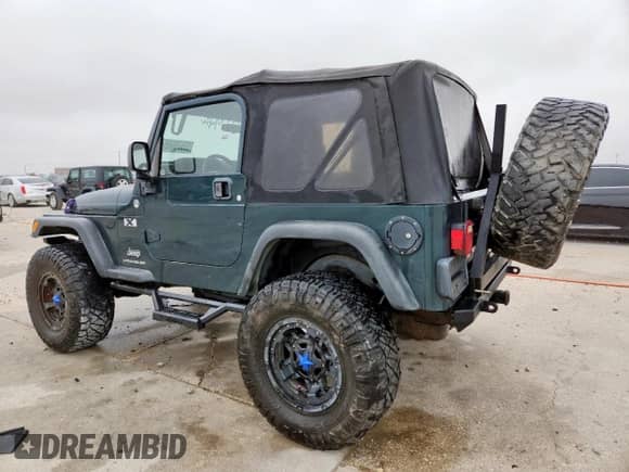 2005 Jeep Wrangler X с VIN 1J4FA39S35P333959, выставлен на аукционе Copart как лот 59576665 с пробегом 261 856 миль миль и Списание • Salvage title. История ставок и продаж доступна на DreamBid. Изображение 2.