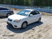 ✅ 2010 Kia Rio LX • VIN: KNADH4A30A6643454 • Lot: 43174512. Listed on IAAI with 264,262 mi. Free auction sales archive from the USA and detailed vehicle history report at DreamBid. Image 2.