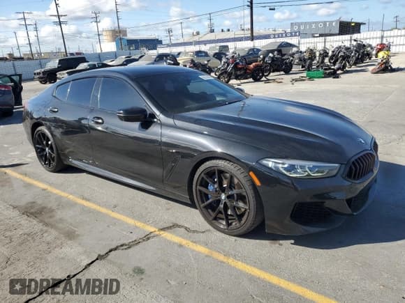 ✅ 2022 BMW 8 Series 840i • VIN: WBAGV2C0XNCG99912 • Лот: 56576685. Опубликован ранее на Copart с пробегом 94 677 миль. Бесплатный доступ к архиву аукционных продаж из США и подробный отчёт об истории автомобиля на DreamBid. Изображение 4.