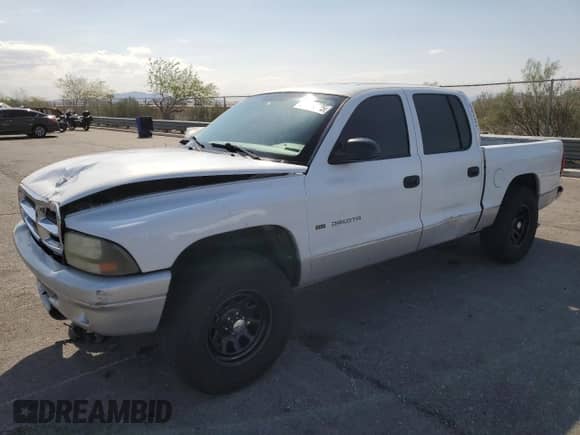2002 Dodge Dakota SLT z VIN 1B7HL48X82S661284, wystawiony jako Copart lot #59824025 z przebiegiem 187 222 mil mil oraz Szkoda całkowita • Salvage title. Historia ofert i sprzedaży dostępna na DreamBid. Obrazek 1.