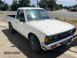 ✅ 1984 Datsun 720 • VIN: JN6ND01S5EX276292 • Lot: 66215945. Wystawiony na Copart z przebiegiem 101 732 mil. Bezpłatny archiwum sprzedaży aukcyjnych z USA i szczegółowy raport historii pojazdu na DreamBid. Zdjęcie 1.