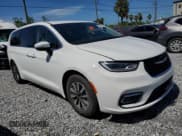 ✅ 2023 Chrysler Pacifica Hybrid Touring L • VIN: 2C4RC1L74PR558768 • Lot: 61407555. Listed on Copart with 70,387 mi. Free auction sales archive from the USA and detailed vehicle history report at DreamBid. Image 4.