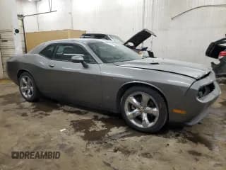✅ 2012 Dodge Challenger SXT Plus • VIN: 2C3CDYAG2CH259685 • Lot: 87326574. Wystawiony na Copart z przebiegiem 142 425 mil. Bezpłatny archiwum sprzedaży aukcyjnych z USA i szczegółowy raport historii pojazdu na DreamBid. Zdjęcie 4.