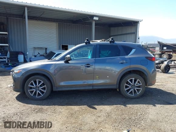 ✅ 2018 Mazda CX-5 Touring • VIN: JM3KFACM8J0338749 • Lot: 41761789. Listed on IAAI with 68,733 mi. Free auction sales archive from the USA and detailed vehicle history report at DreamBid. Image 14.
