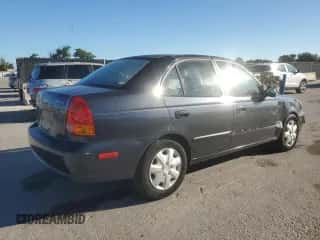 2005 Hyundai Accent GLS z VIN KMHCG45C05U665091, wystawiony jako Copart lot #87264075 z przebiegiem 179 141 mil mil oraz Szkoda całkowita • Salvage title. Historia ofert i sprzedaży dostępna na DreamBid. Obrazek 3.