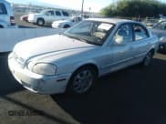 ✅ 2005 Kia Optima LX • VIN: KNAGD128355397304 • Лот: 43552283. Опубликован ранее на IAAI с пробегом 113 401 миль. Бесплатный доступ к архиву аукционных продаж из США и подробный отчёт об истории автомобиля на DreamBid. Изображение 2.