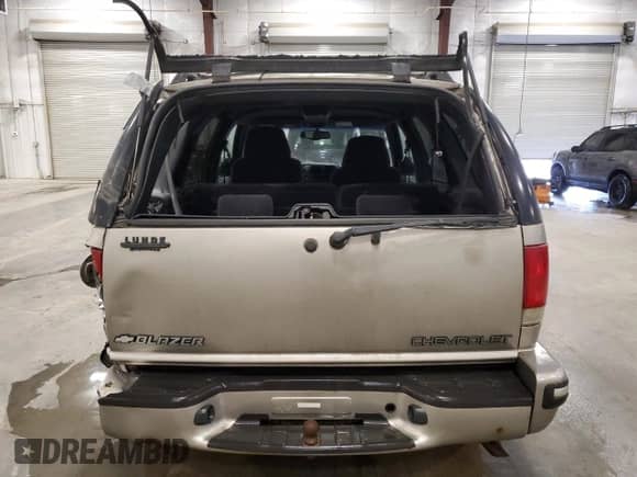 1999 Chevrolet Blazer LT z VIN 1GNDT13W3X2151872, wystawiony jako Copart lot #50419615 z przebiegiem 94 520 mil mil oraz Szkoda całkowita • Salvage title. Historia ofert i sprzedaży dostępna na DreamBid. Obrazek 6.