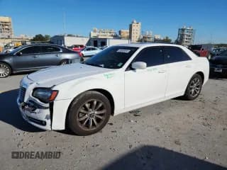 ✅ 2014 Chrysler 300 S • VIN: 2C3CCAGG9EH331485 • Lot: 85658065. Listed on Copart with 144,865 mi. Free auction sales archive from the USA and detailed vehicle history report at DreamBid. Image 1.
