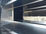 ✅ 2021 Ford Transit Cargo • VIN: 1FTBR3XG8MKA89703 • Lot: 42885214. Listed on IAAI with 79,907 mi. Free auction sales archive from the USA and detailed vehicle history report at DreamBid. Image 8.