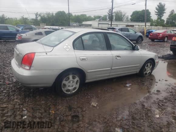 2003 Hyundai Elantra GLS z VIN KMHDN45D23U505391, wystawiony jako Copart lot #52038974 z przebiegiem 85 562 mil mil oraz Czysty tytuł • Clean title. Historia ofert i sprzedaży dostępna na DreamBid. Obrazek 3.