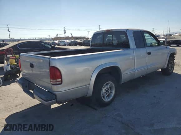 2002 Dodge Dakota Sport z VIN 1B7GL32X02S643294, wystawiony jako Copart lot #68203165 z przebiegiem 189 431 mil mil oraz Szkoda całkowita • Salvage title. Historia ofert i sprzedaży dostępna na DreamBid. Obrazek 3.