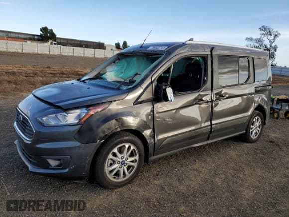 ✅ 2022 Ford Transit Connect XLT • VIN: NM0GE9F22N1544012 • Lot: 78942744. Listed on Copart with 33,652 mi. Free auction sales archive from the USA and detailed vehicle history report at DreamBid. Image 1.