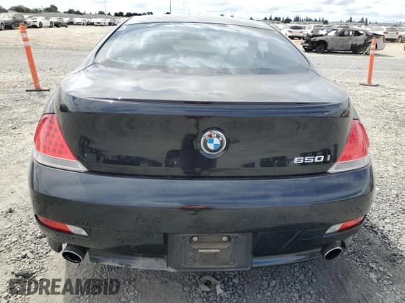 ✅ 2007 BMW 6 Series 650i • VIN: WBAEH13517CR52037 • Лот: 80124315. Опубликован ранее на Copart с пробегом 104 702 миль. Бесплатный доступ к архиву аукционных продаж из США и подробный отчёт об истории автомобиля на DreamBid. Изображение 6.
