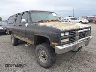 ✅ 1989 Chevrolet Suburban • VIN: 1GNGV26K9KF127972 • Lot: 43163403. Listed on IAAI with 50,367 mi. Free auction sales archive from the USA and detailed vehicle history report at DreamBid. Image 1.