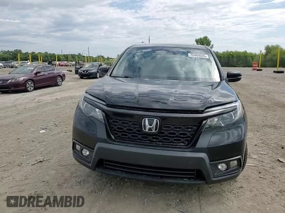 ✅ 2021 Honda Passport EX-L • VIN: 5FNYF8H57MB035500 • Lot: 70460035. Listed on Copart with 56,048 mi. Free auction sales archive from the USA and detailed vehicle history report at DreamBid. Image 14.