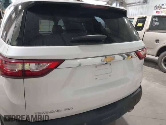 2019 Chevrolet Traverse LT Cloth z VIN 1GNEVGKW1KJ298306, wystawiony jako IAAI lot #43302460 z przebiegiem 76 785 mil mil oraz . Historia ofert i sprzedaży dostępna na DreamBid. Obrazek 16.