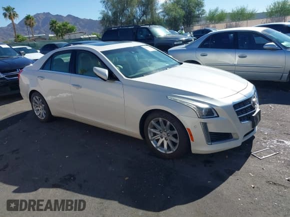 ✅ 2014 Cadillac CTS Performance RWD • VIN: 1G6AS5S31E0131693 • Lot: 42699171. Listed on IAAI with 104,565 mi. Free auction sales archive from the USA and detailed vehicle history report at DreamBid. Image 1.