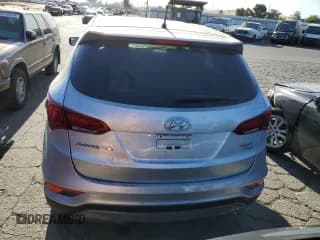 ✅ 2018 Hyundai Santa Fe 2.4L • VIN: 5XYZTDLB8JG559410 • Лот: 60527774. Опубликован ранее на Copart с пробегом 83 560 миль. Бесплатный доступ к архиву аукционных продаж из США и подробный отчёт об истории автомобиля на DreamBid. Изображение 6.