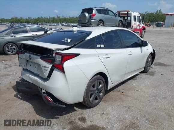 2021 Toyota Prius L Eco with VIN JTDKAMFU4M3149362, listed as a IAAI auction lot 42636584 with 180,786 mi miles and . Bid and sale history available at DreamBid. Image 4.