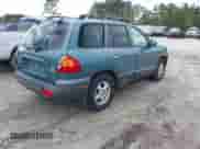 2002 Hyundai Santa Fe GLS with VIN KM8SC73D22U245851, listed as a IAAI auction lot 41733222 with 184,179 mi miles and . Bid and sale history available at DreamBid. Image 4.