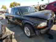 2001 Dodge Dakota Sport z VIN 1B7GL22Z01S315190, wystawiony jako Copart lot #60171404 z przebiegiem 145 397 mil mil oraz Nie do naprawy • Non repairable. Historia ofert i sprzedaży dostępna na DreamBid. Obrazek 4.