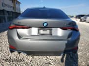 ✅ 2024 BMW i4 eDrive40 • VIN: WBY73AW0XRFS45402 • Лот: 86451175. Опубликован ранее на Copart с пробегом 18 652 миль. Бесплатный доступ к архиву аукционных продаж из США и подробный отчёт об истории автомобиля на DreamBid. Изображение 6.