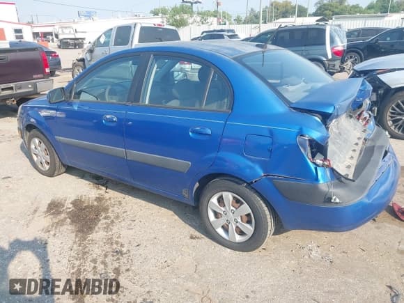 ✅ 2009 Kia Rio LX • VIN: KNADE223596456850 • Lot: 43255869. Wystawiony na IAAI z przebiegiem 214 486 mil. Bezpłatny archiwum sprzedaży aukcyjnych z USA i szczegółowy raport historii pojazdu na DreamBid. Zdjęcie 3.