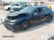 2021 Toyota Camry SE with VIN 4T1T11BKXMU042040, listed as a IAAI auction lot 42879951 with 35,130 mi miles and . Bid and sale history available at DreamBid. Image 2.