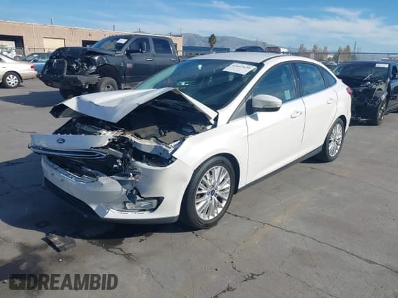 ✅ 2015 Ford Focus Titanium • VIN: 1FADP3J26FL349269 • Лот: 43662639. Опубликован ранее на IAAI с пробегом 114 228 миль. Бесплатный доступ к архиву аукционных продаж из США и подробный отчёт об истории автомобиля на DreamBid. Изображение 18.