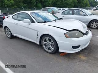 ✅ 2006 Hyundai Tiburon GT • VIN: KMHHN65F06U219476 • Лот: 42763275. Опубликован ранее на IAAI с пробегом 169 832 миль. Бесплатный доступ к архиву аукционных продаж из США и подробный отчёт об истории автомобиля на DreamBid. Изображение 1.