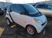 ✅ 2009 Smart fortwo Pure • VIN: WMEEJ31X99K292492 • Lot: 41029051. Listed on IAAI with 57,741 mi. Free auction sales archive from the USA and detailed vehicle history report at DreamBid. Image 1.