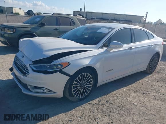 ✅ 2017 Ford Fusion Hybrid Titanium • VIN: 3FA6P0RU1HR138028 • Lot: 43725051. Listed on IAAI with 85,361 mi. Free auction sales archive from the USA and detailed vehicle history report at DreamBid. Image 2.