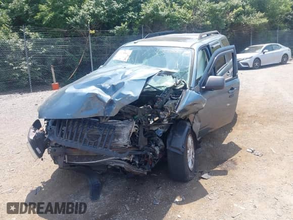 2010 Mercury Mariner with VIN 4M2CN9BG3AKJ28830, listed as a IAAI auction lot 42328802 with 116,650 mi miles and . Bid and sale history available at DreamBid. Image 14.