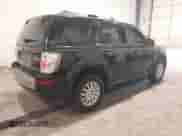 2010 Mercury Mariner Premier with VIN 4M2CN9HG2AKJ19690, listed as a IAAI auction lot 43221081 with 136,828 mi miles and . Bid and sale history available at DreamBid. Image 4.