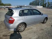 ✅ 2005 Kia Spectra • VIN: KNAFE161355121968 • Lot: 54621465. Listed on Copart with 221,951 mi. Free auction sales archive from the USA and detailed vehicle history report at DreamBid. Image 3.